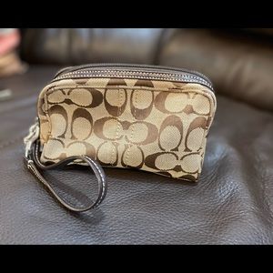 Small Coach Bag. Can be used as a cosmetic bag or wristlet.